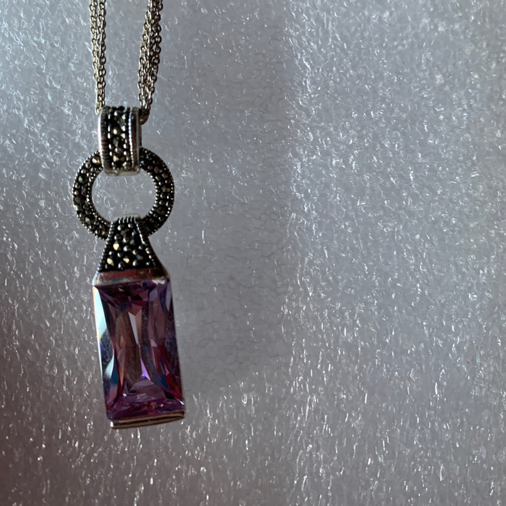 Lavender stone marcasite setting. Lots of shimmer.
